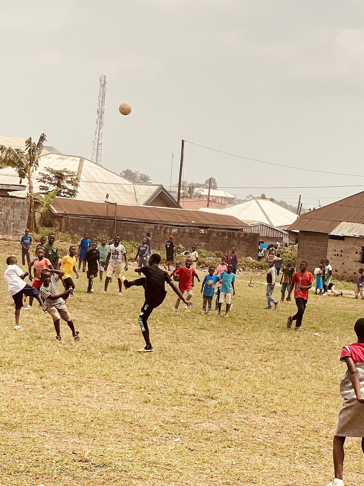 Children playing at a school field in Buea