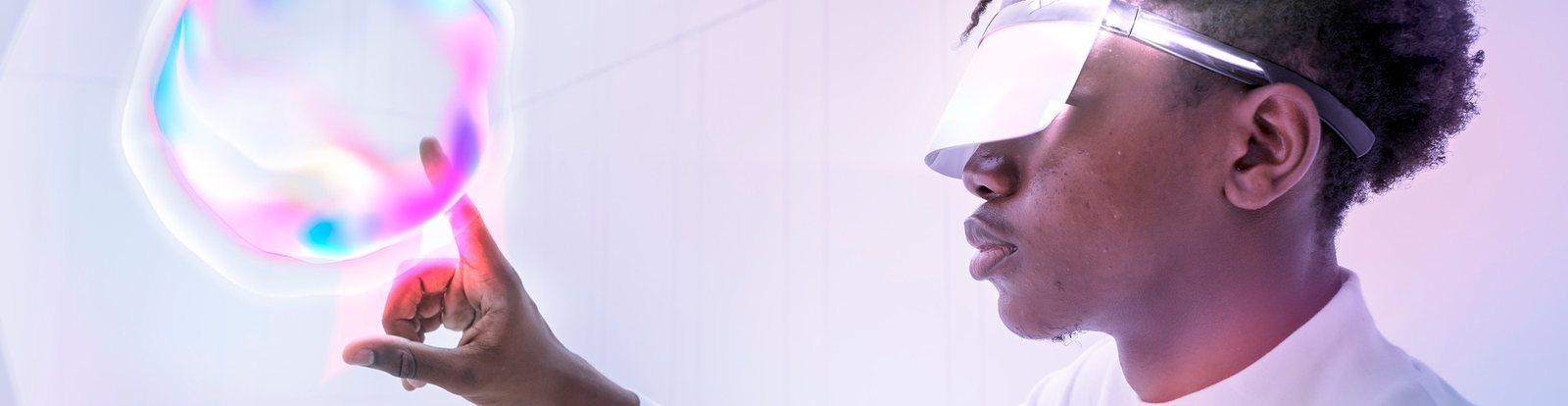 A student reaching towards a point of light